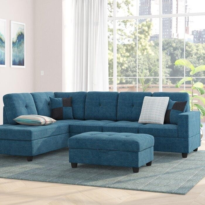 синий угловой диван с пуфиком.jpeg